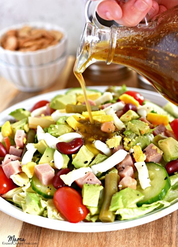 Balsamic Vinaigrette Salad Dressing being poured on top of a salad