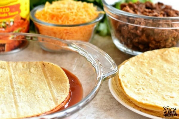 corn tortillas ,Old El Paso mild red enchilada sauce, cheddar cheese and taco meat