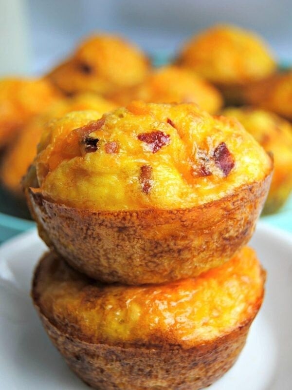 2 Hash Brown Egg Cups stacked on top of each other with more in the background