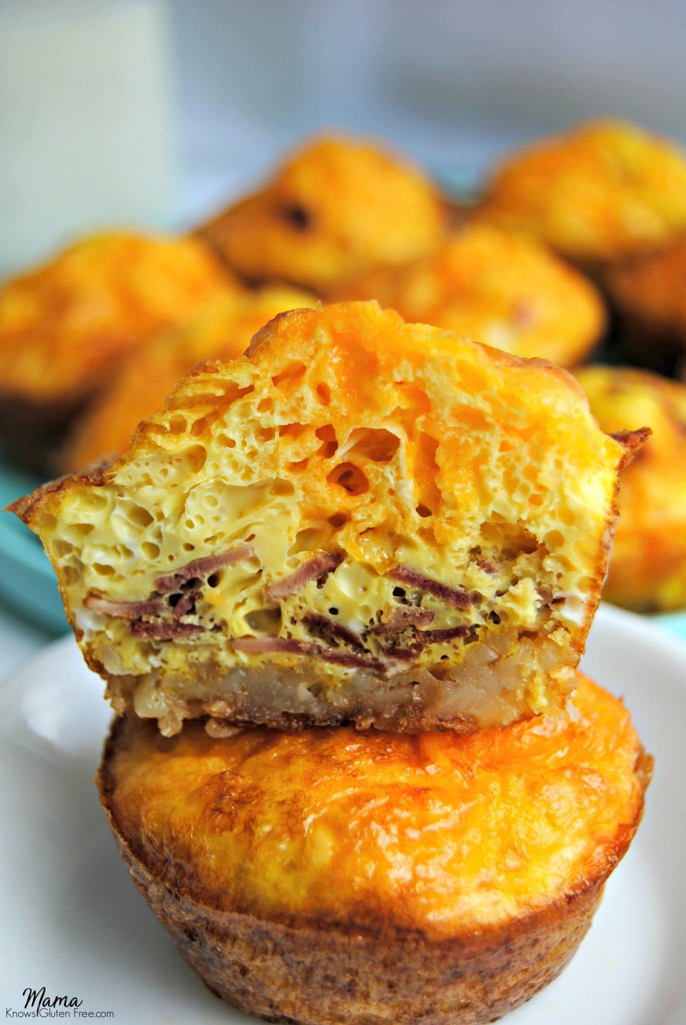 2 Hash Brown Egg Cups stacked on top of each other and one is cut in half to show fillings