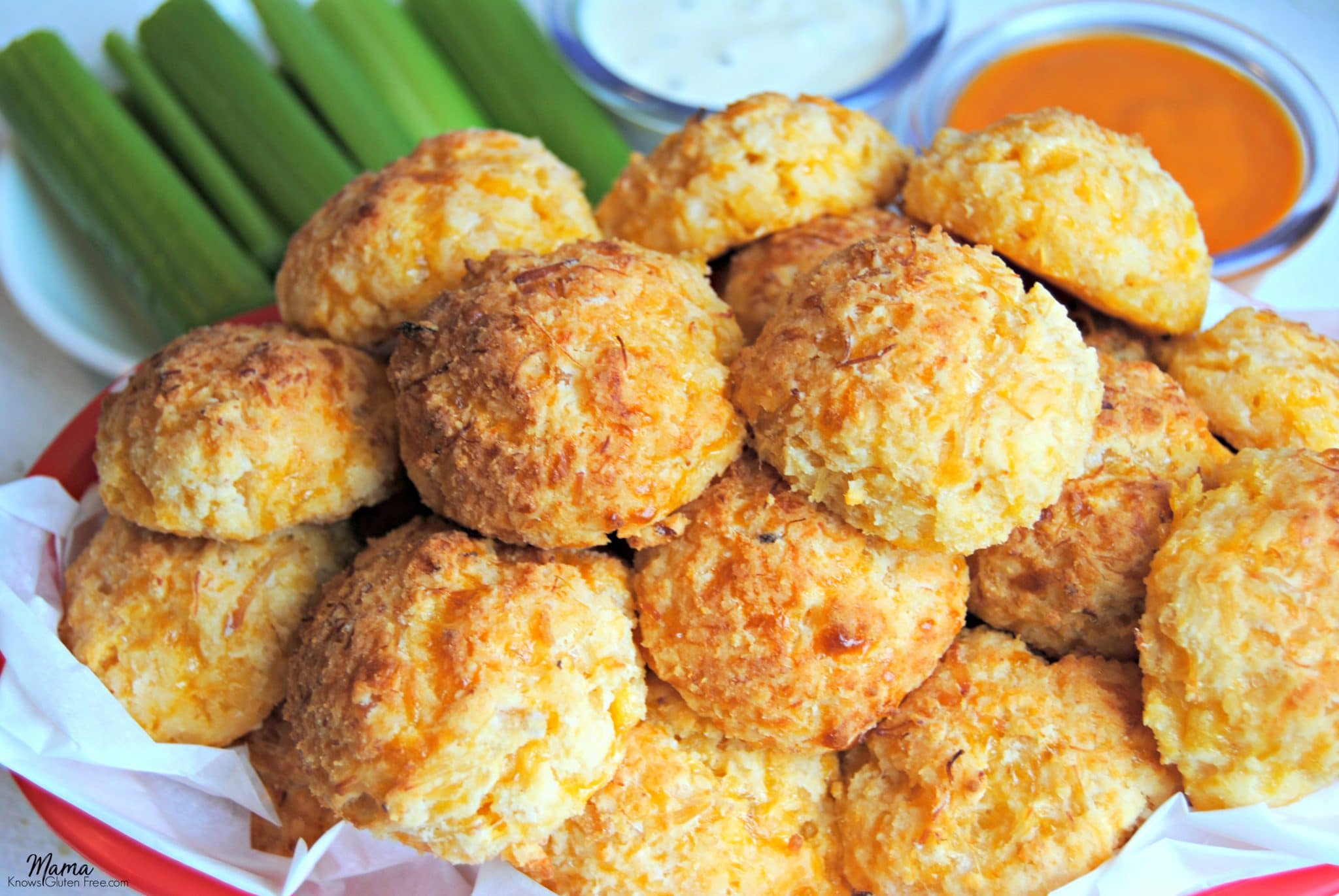 gluten-free buffalo chicken bites in a basket with celery and sauce 