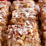 gluten-free apple pie blondies with red apples in the background