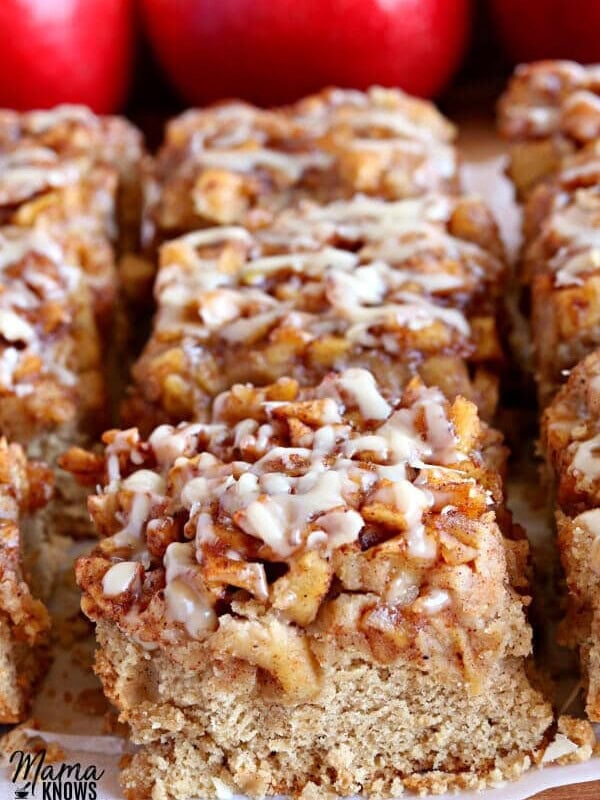 gluten-free apple pie blondies with red apples in the background