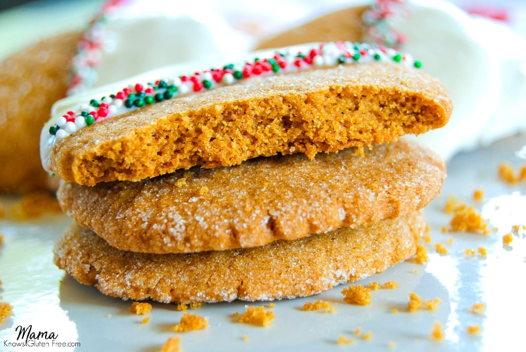 Three Gluten-Free White Chocolate-Dipped Gingerbread Cookies stacked on top of each other