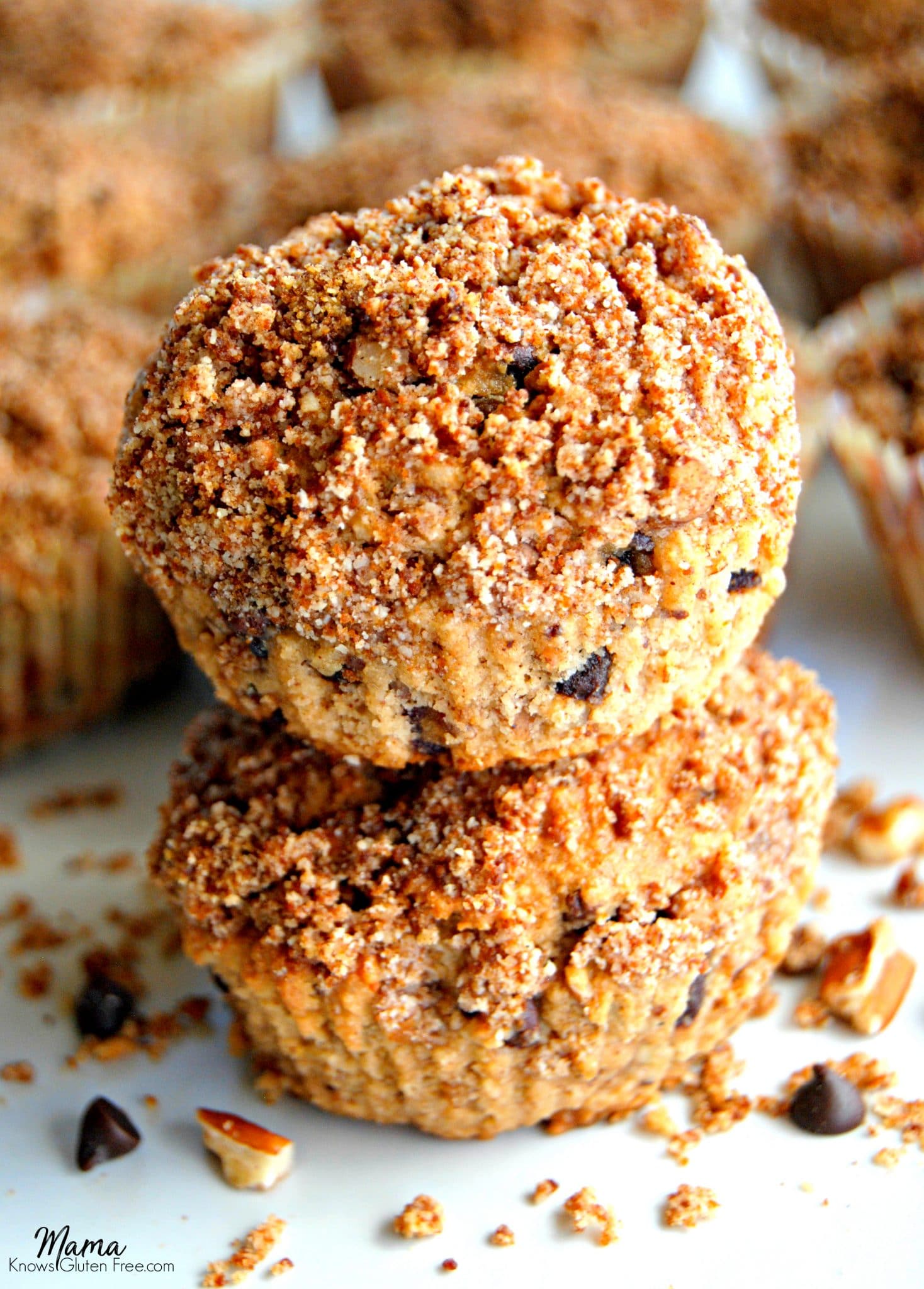 Paleo Chocolate Chip Pecan Pie Muffins with two stacked on top of each other.