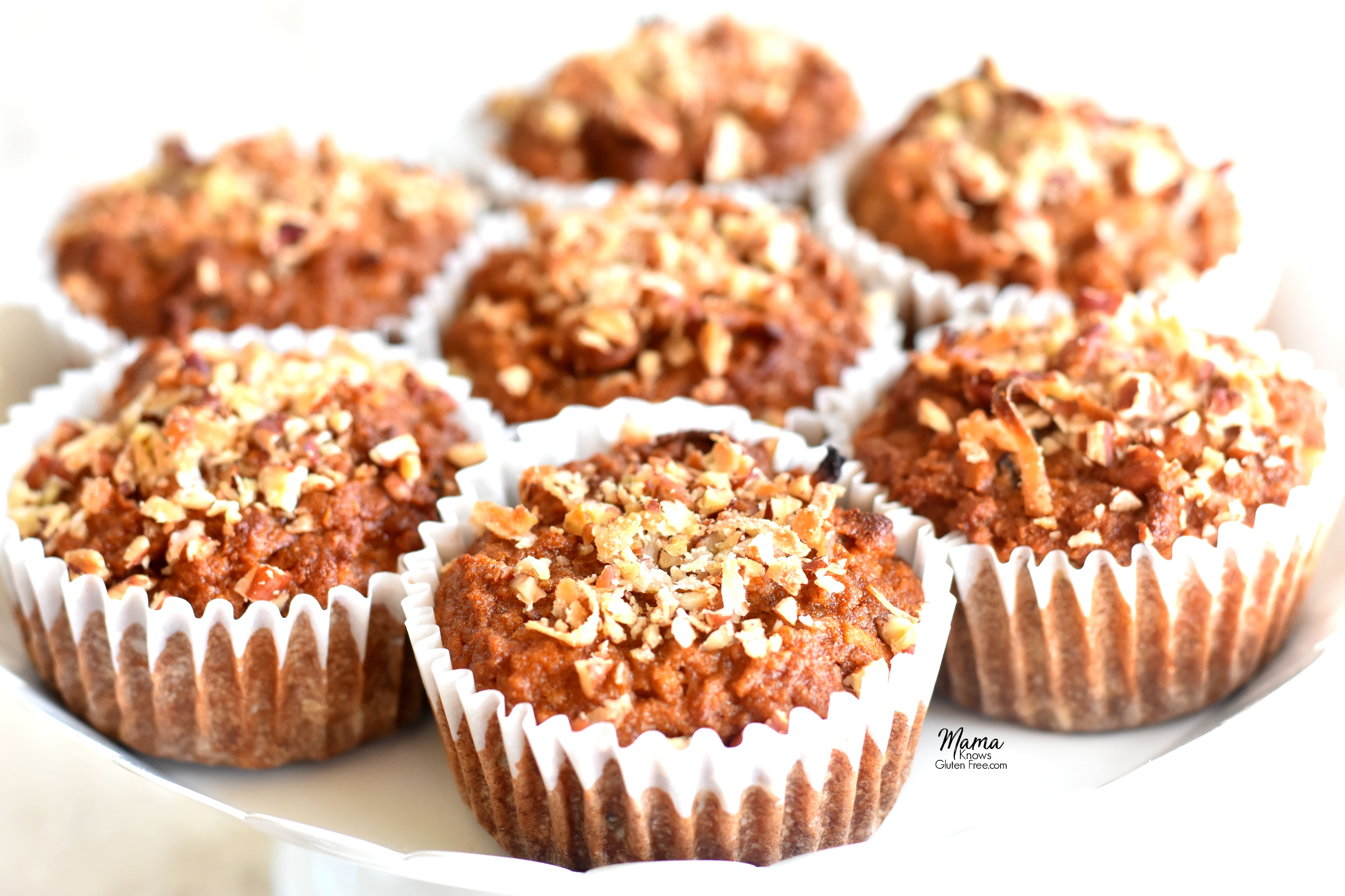 7 Paleo carrot cake muffins on a white cake stand