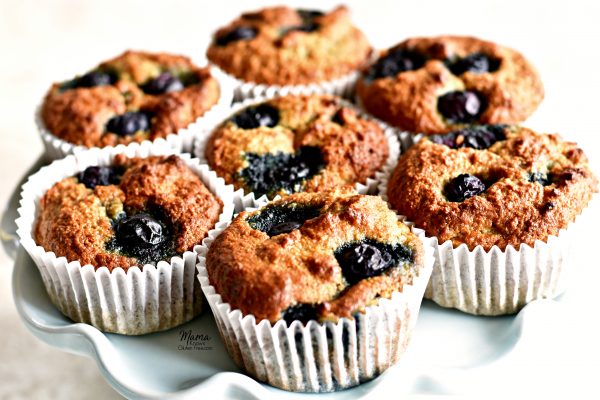 7 Paleo blueberry banana muffins on a cake stand