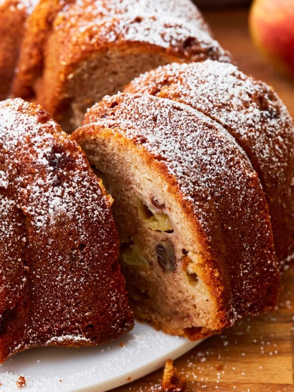 A close up of a sliced gluten-free apple cake.