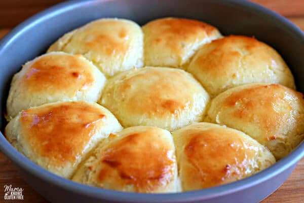 a round pan of buttered gluten-free dinner rolls