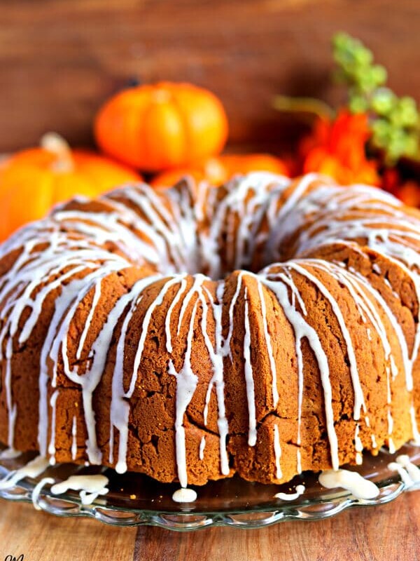 gluten-free pumpkin bundt cake with pumpkins in the background