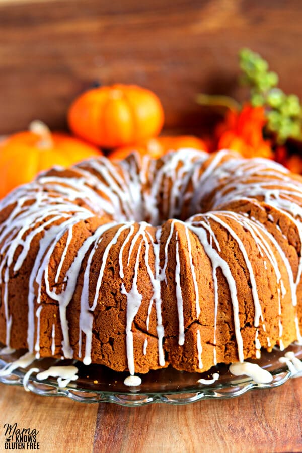 gluten-free pumpkin bundt cake with pumpkins in the background