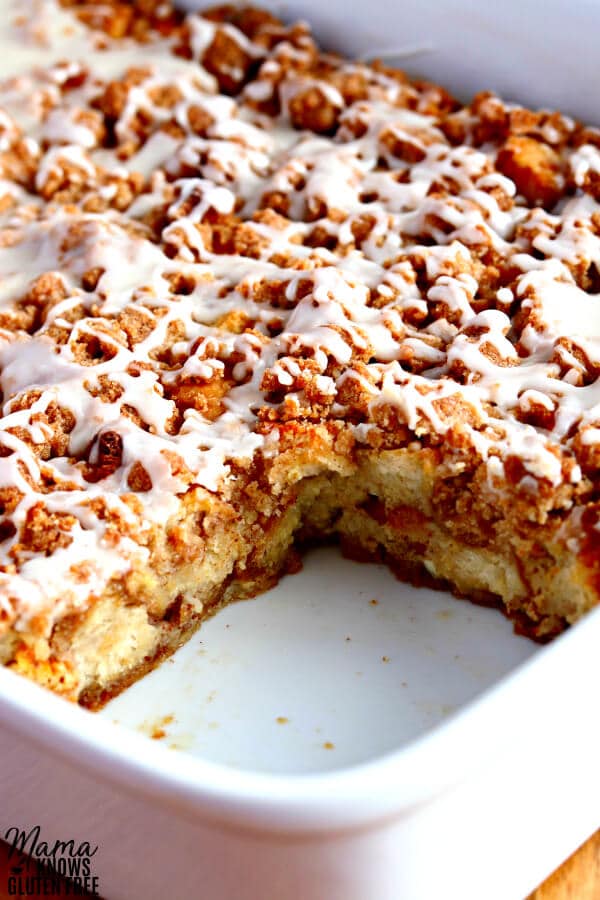 gluten-free french toast casserole in a casserole dish with on serving cut out