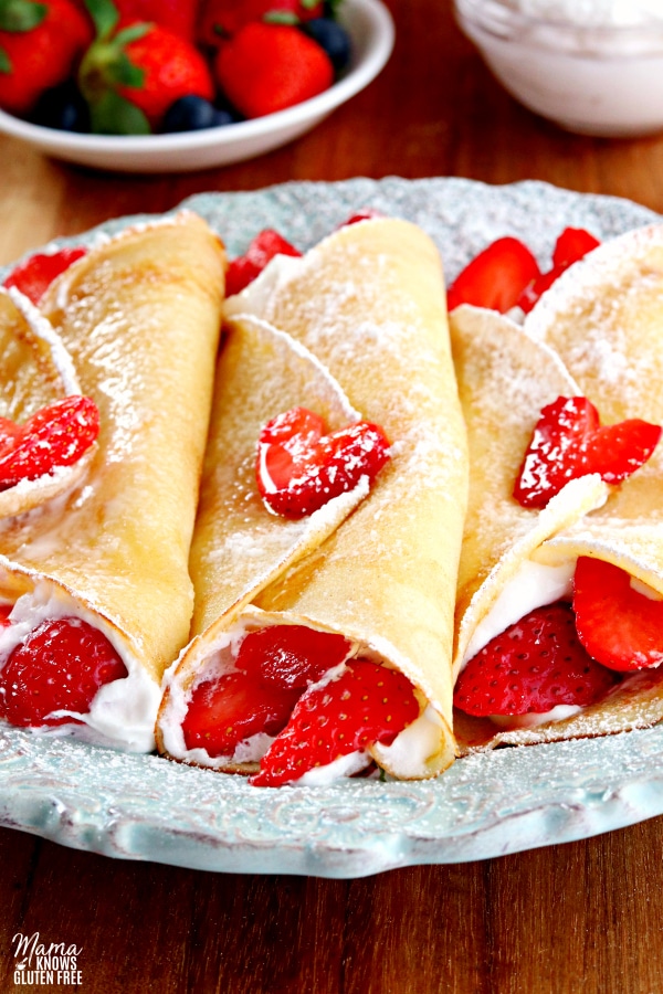 3 gluten-free crepes filled with strawberries and whipped cream