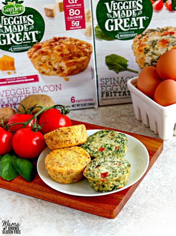 plate of 4 Garden Lites Frittatas with eggs, tomatoes, spinach and the packaging in the background
