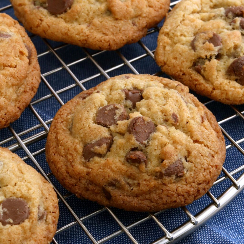 gluten-free chocalte chip cookies on cooling rack with blue kitchen towel