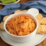 gluten-free buffalo chicken dip in a white bowl with crackers