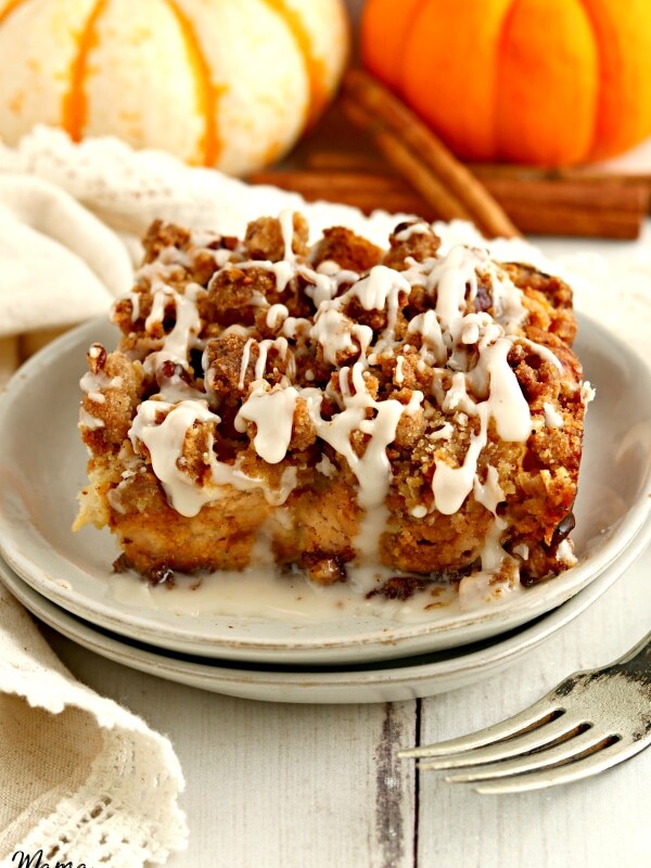 a serving of gluten-free pumpkin French toast casserole on a white plate with a fork