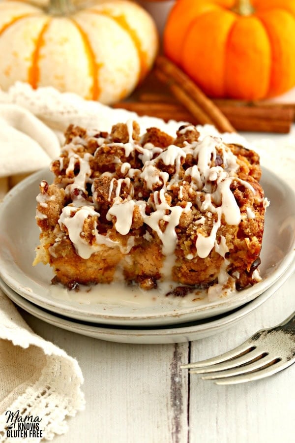 a serving of gluten-free pumpkin French toast casserole on a white plate with a fork