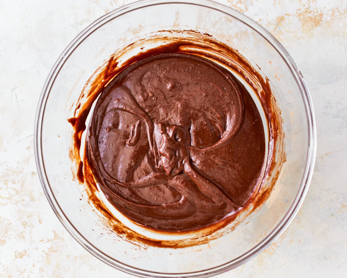 gluten free brownie batter in a glass bowl.