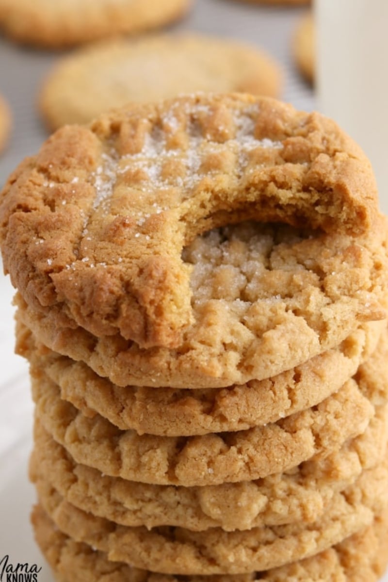 gluten-free peanut butter cookie with bite out of it to show texture of the cookies
