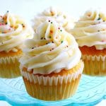 gluten-free vanilla cupcakes on a blue cake plate