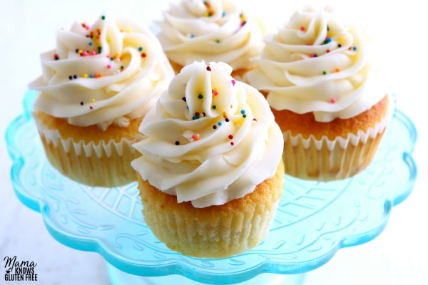 gluten-free vanilla cupcakes on a blue cake plate