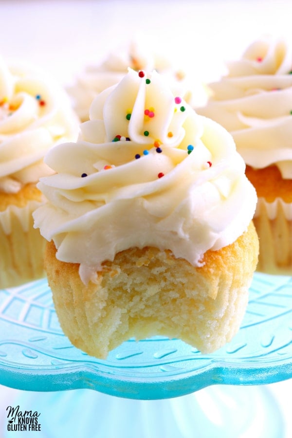 gluten-free vanilla cupcake with bit out of it to show the texture