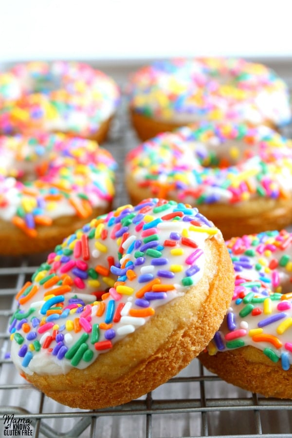 gluten-free vanilla donuts on a silver cooling rack