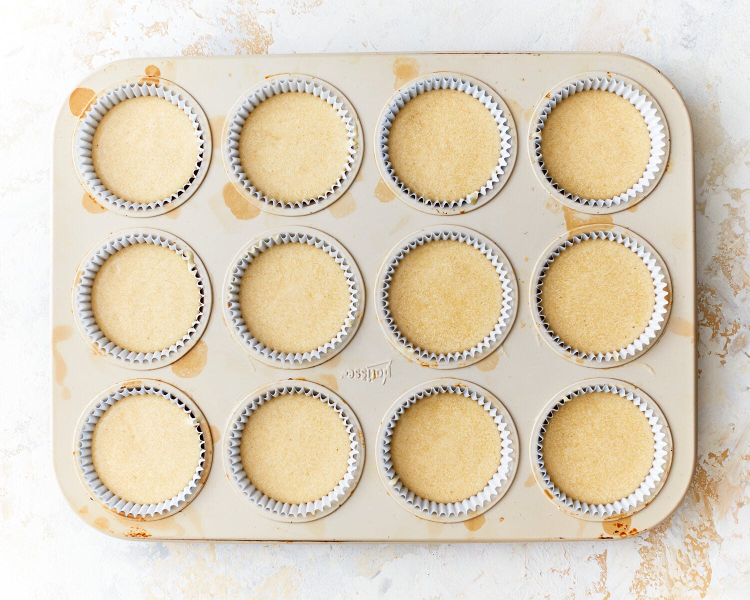 cupcake batter in a cupcake tin.