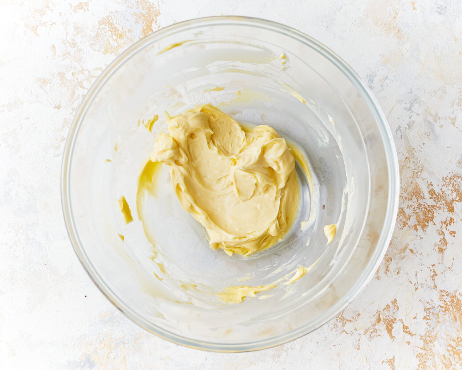 thick beaten butter in a glass bowl.