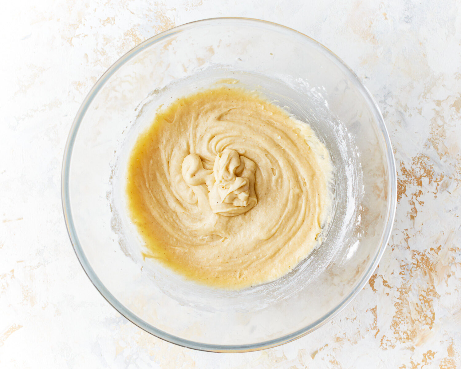 thick batter in a glass bowl.