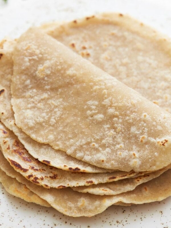 gluten-free tortillas folded on a white plate