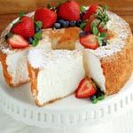 gluten-free angel food cake topped with strawberries and blueberries