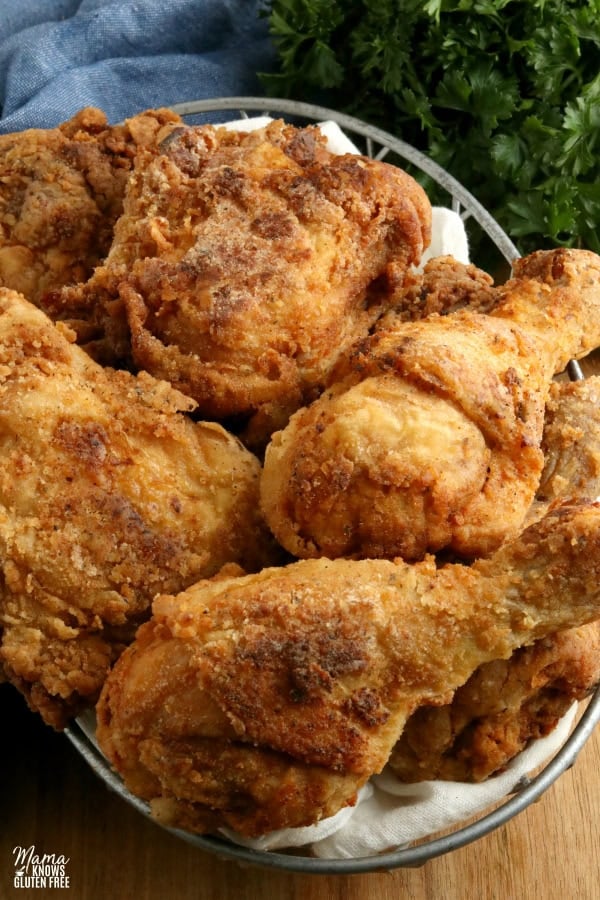 gluten-free fried chicken in a basket with parsley in the background