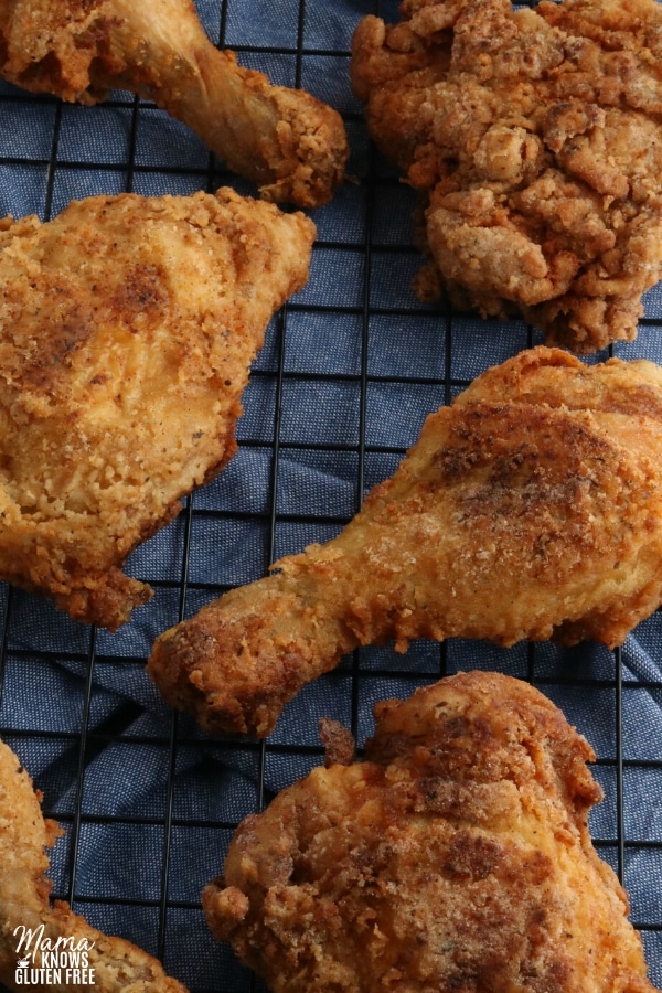 gluten-free fried chicken on a black cooling rack