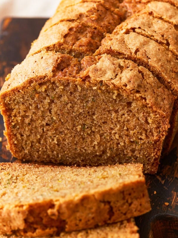gluten-free zucchini bread sliced on a wood cutting board