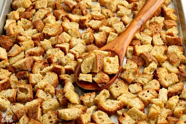 gluten-free croutons with a wooden spoon