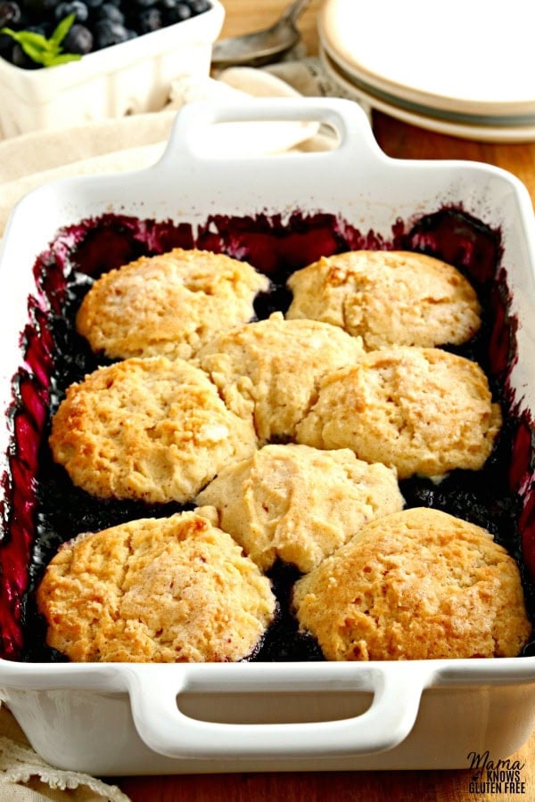 white baking dish of gluten-free blueberry cobbler