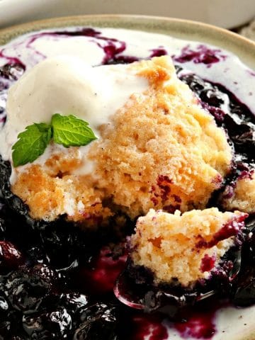 gluten-free blueberry cobbler topped with ice cream