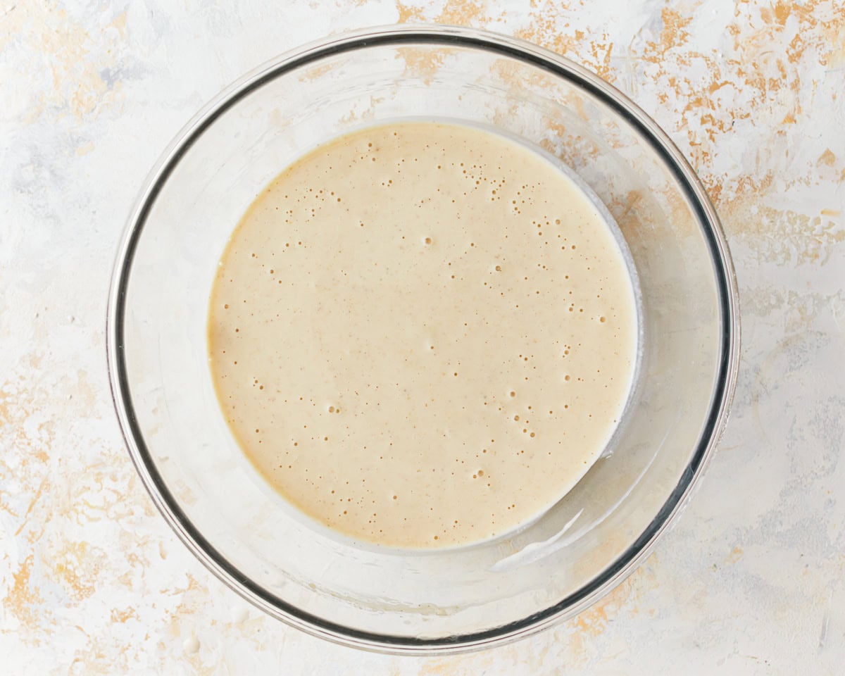 loose waffle batter in a glass bowl.