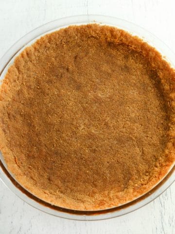 gluten-free graham cracker crust in a glass pie pan