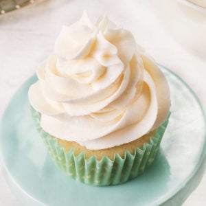 gluten-free frosting piped on top of a vanilla cupcake