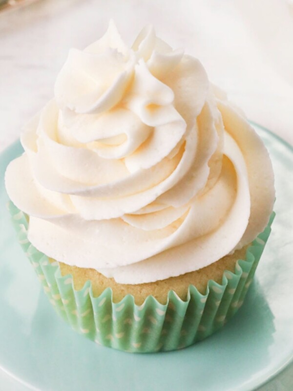 gluten-free frosting piped on top of a vanilla cupcake
