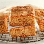 gluten-free blondies stacked on top of each other on a cooling rack