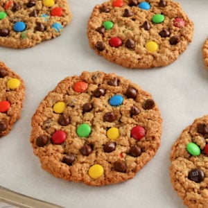 gluten-free monster cookies on white parchment paper.