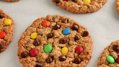 gluten-free monster cookies on white parchment paper.