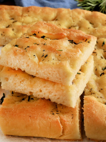 gluten-free focaccia bread sliced and stacked on top of each other