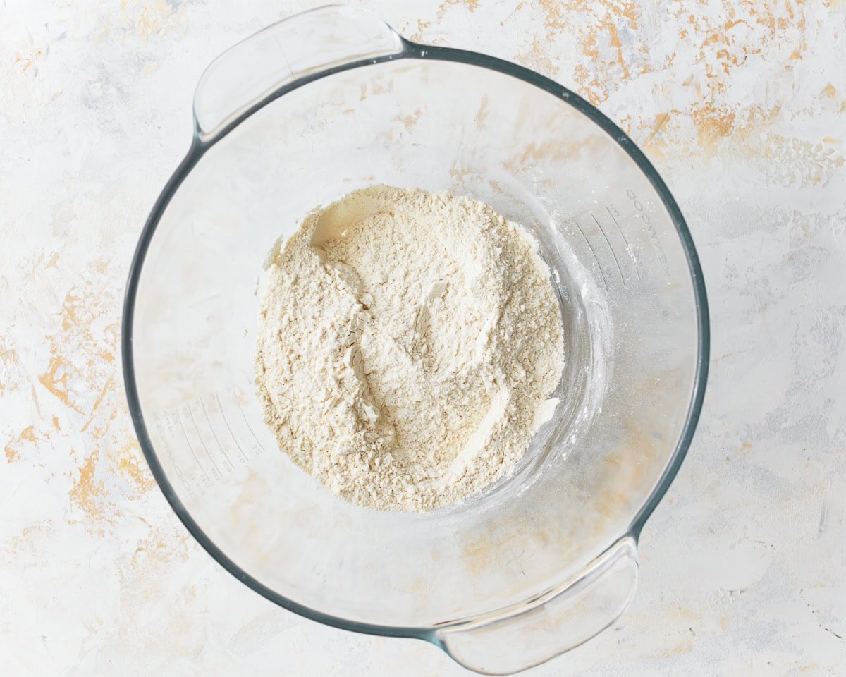 dry ingredients for gluten-free focaccia in a glass bowl.