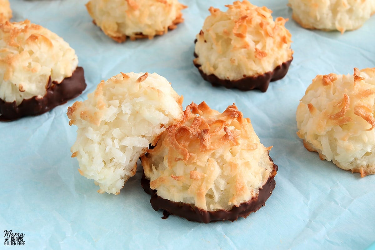 gluten-free coconut macaroons with one cookie halved to show the cookie's texture