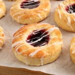 gluten-free Danish topped with jam on on white parchment paper